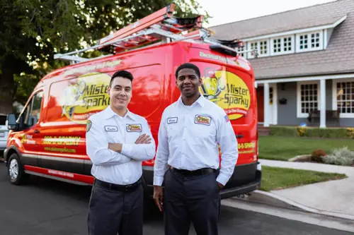 Mister Sparky electricians standing in front of a service van in Southern Minnesota