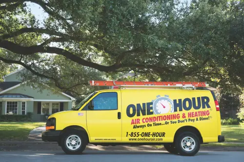 A One Hour Air Conditioning Van outfront a home in Minnesota for a furnace repair.